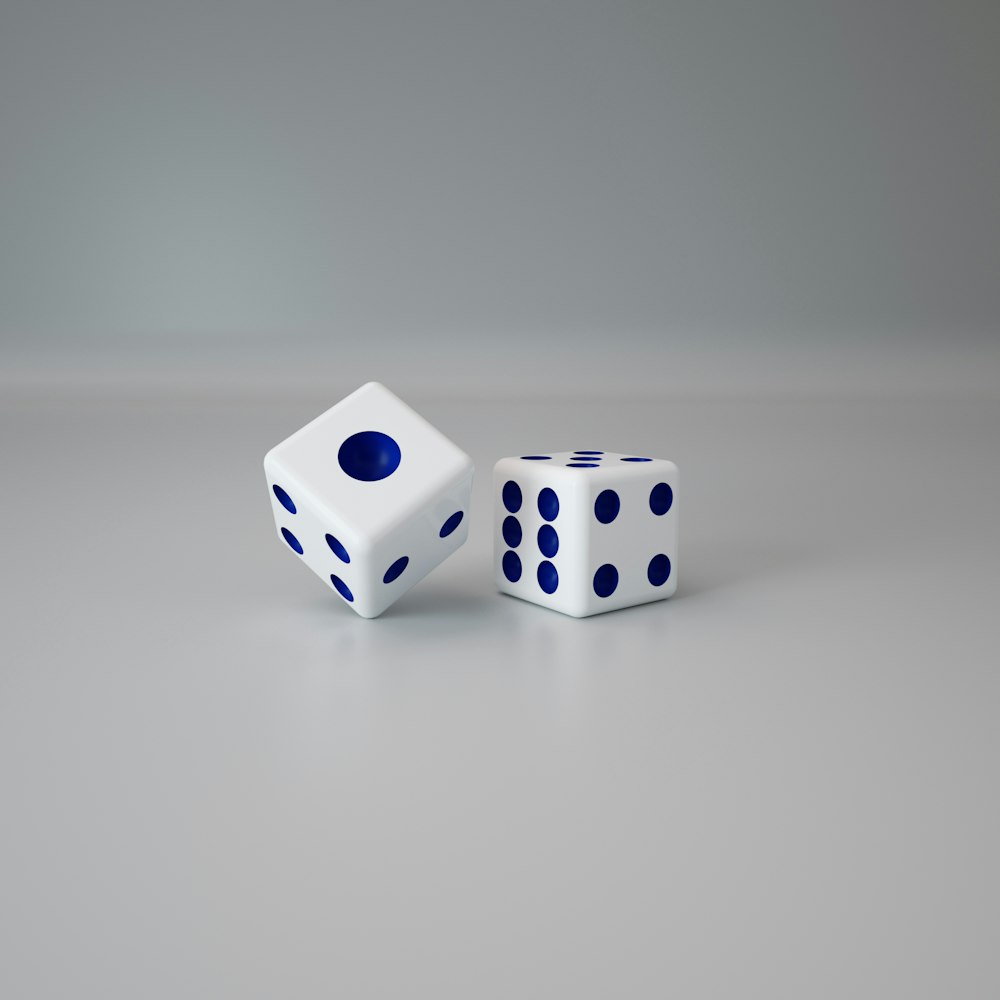 a pair of dices sitting on top of a table