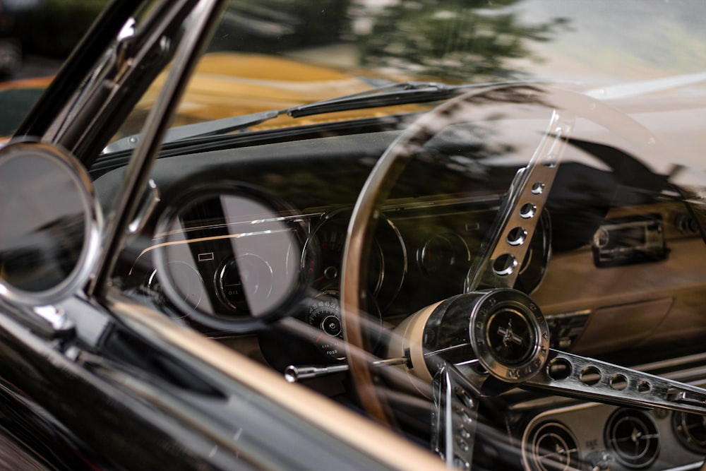 the interior of a classic car with the door open