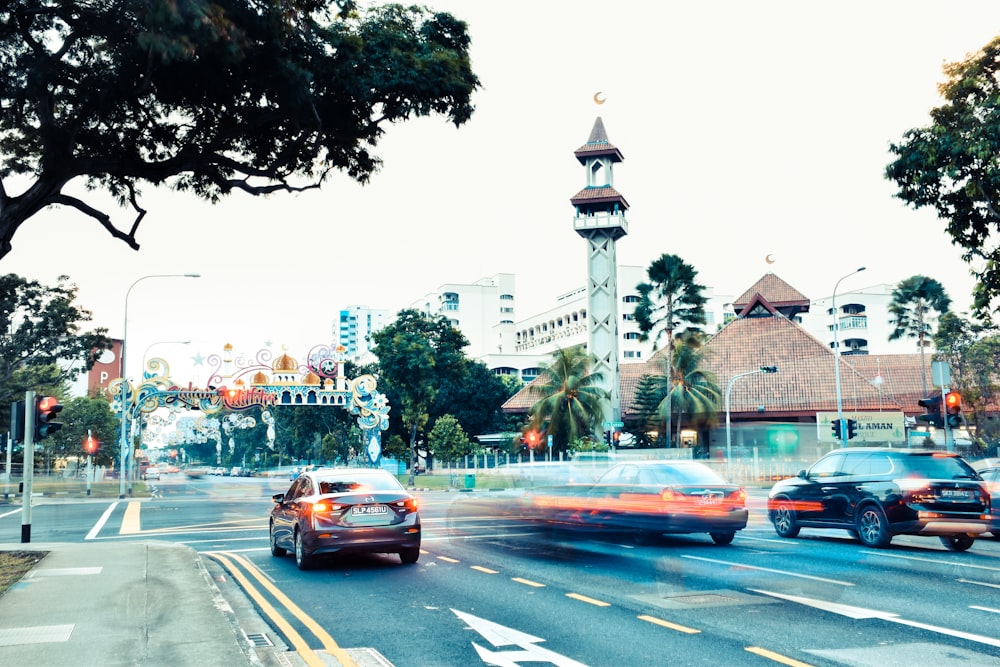 a city street with cars driving down it