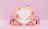 A heart-shaped frame with a gold outline is surrounded by floating pink hearts and several gift boxes wrapped with pink paper and gold ribbons. Pink shopping bags are placed on both sides, creating a celebratory and romantic atmosphere against a pink background.