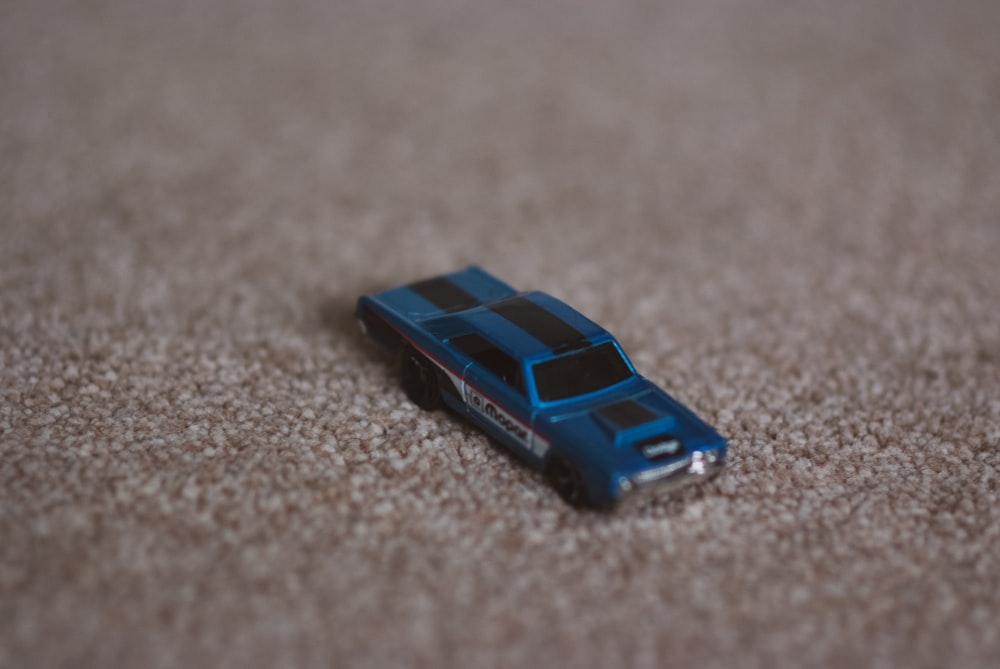 a toy car is laying on the floor