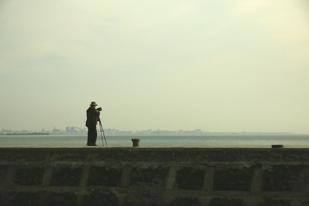 a person with a camera on a beach