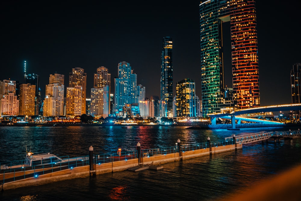 a night view of a city with tall buildings