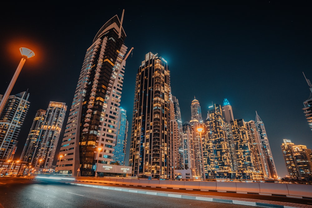 a city at night with a lot of tall buildings