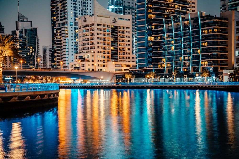 a large body of water in front of tall buildings