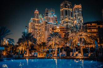 a large swimming pool surrounded by tall buildings