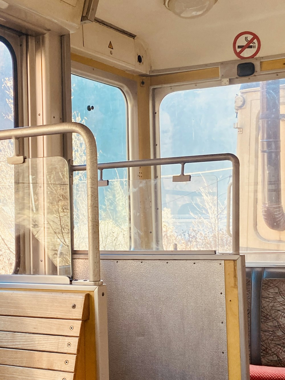 the inside of a train car with two windows