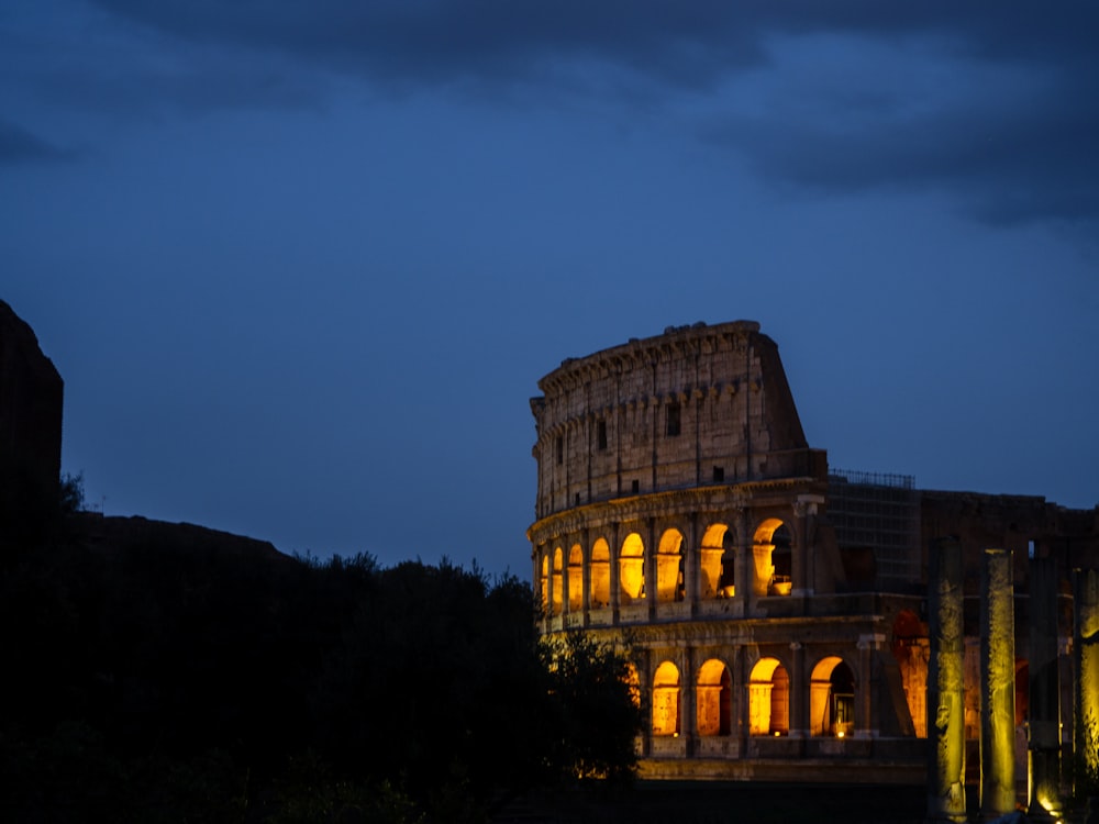 a roman colossion lit up at night