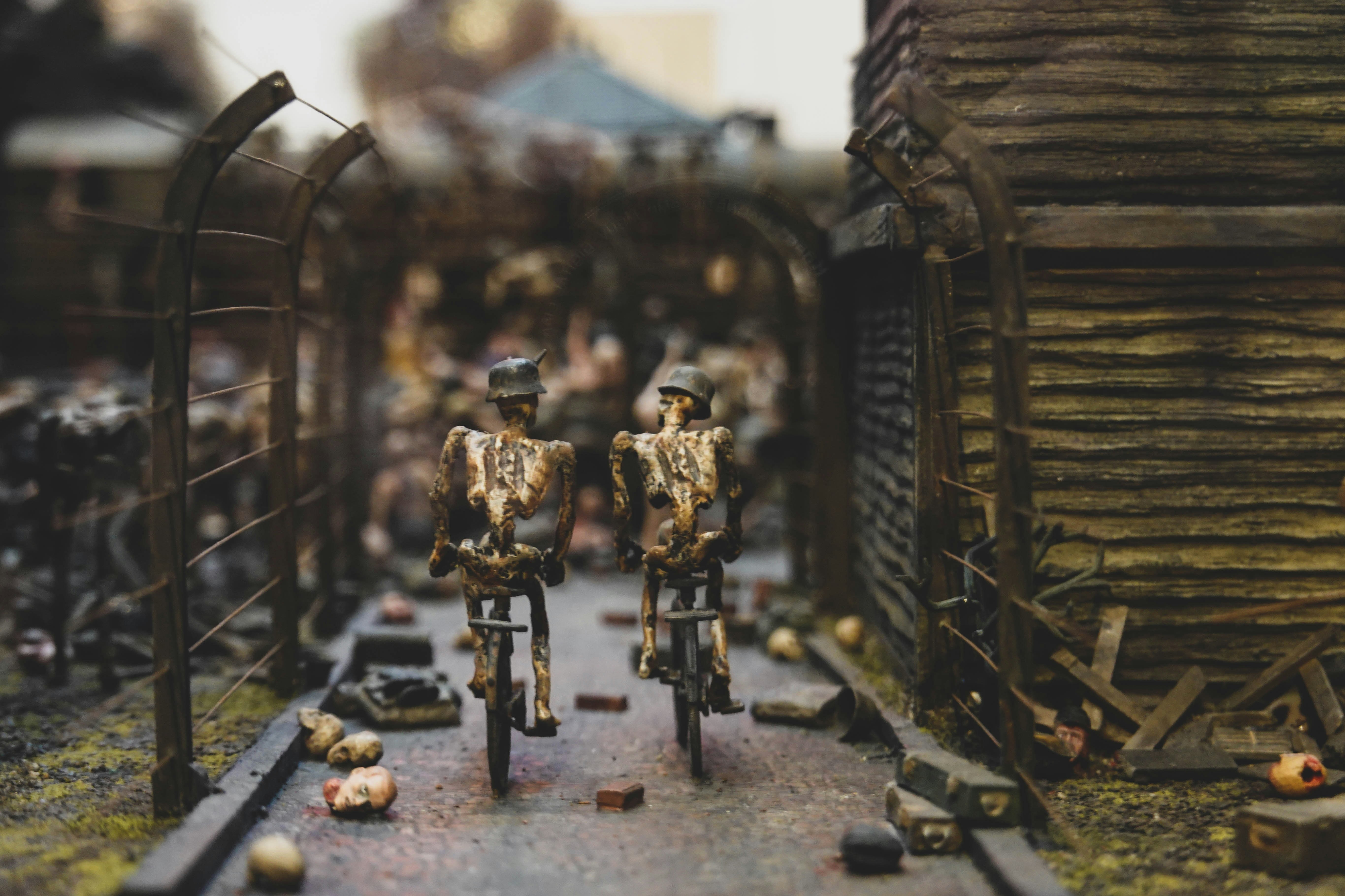 a couple of figurines that are on a bike