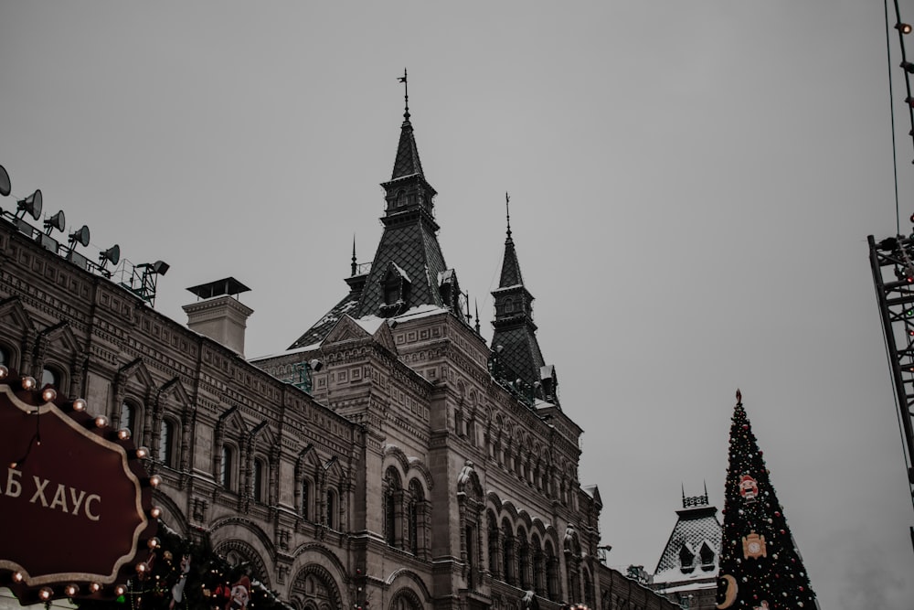 a large building with a christmas tree in front of it