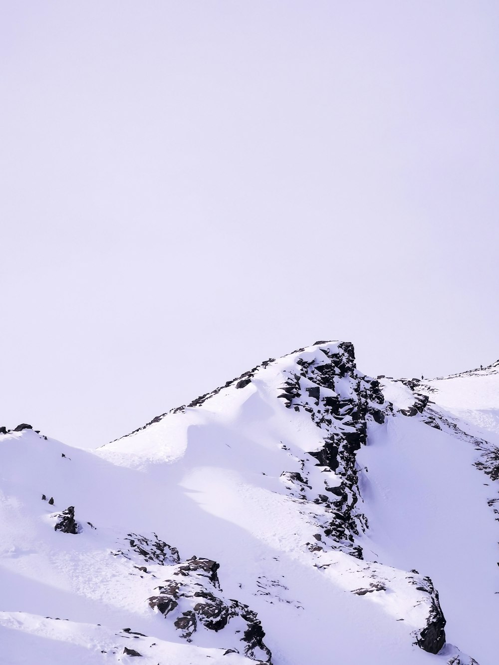 a person skiing down a snow covered mountain