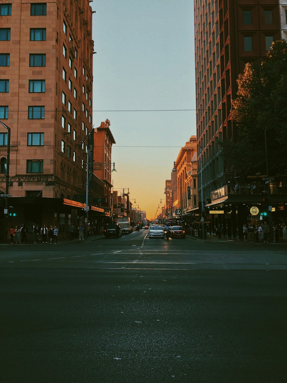 a city street filled with traffic and tall buildings