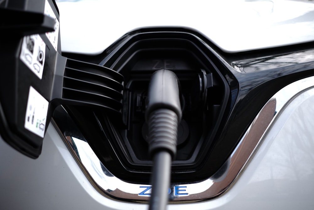 a close up of a car's fuel nozzle