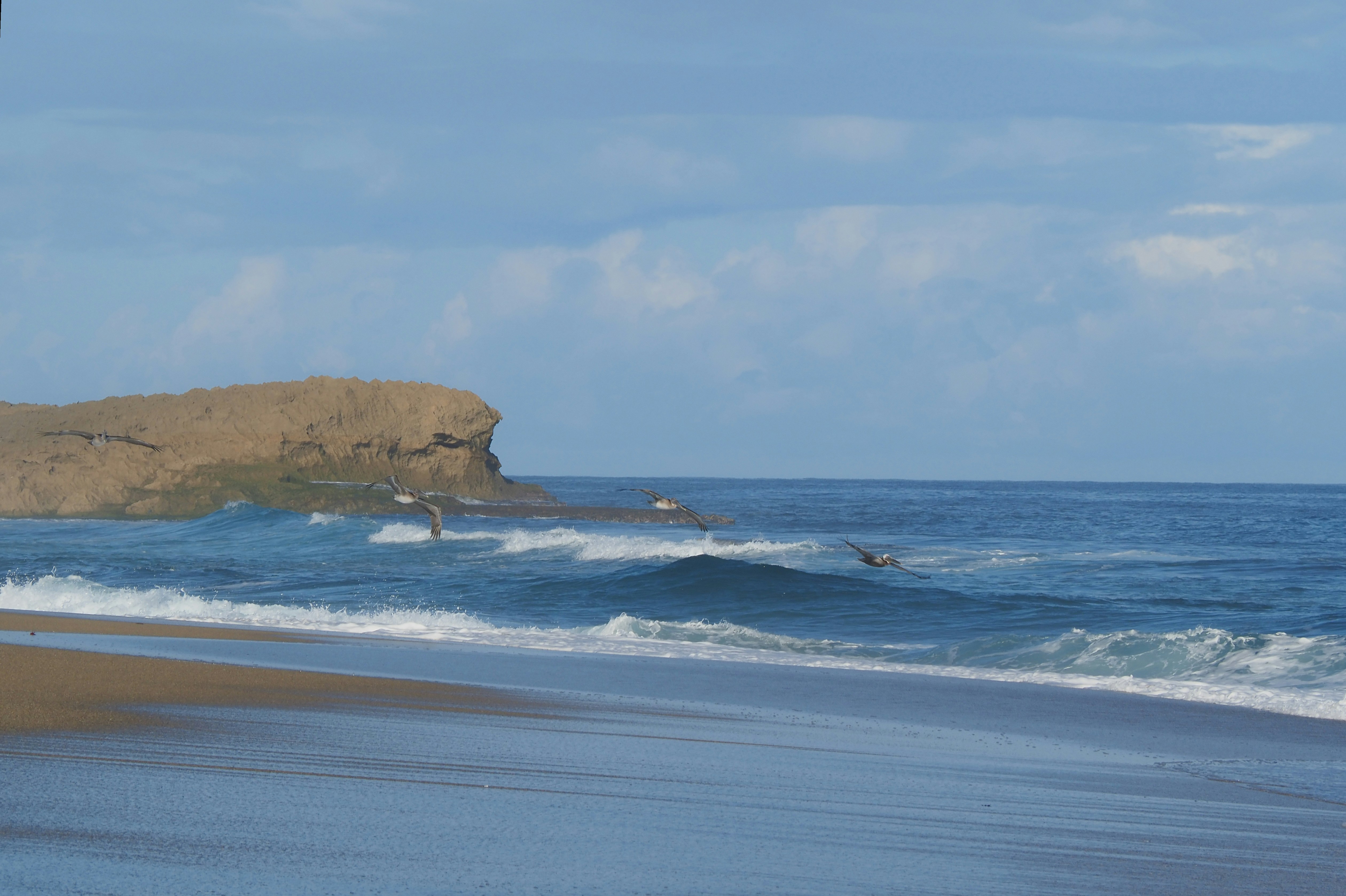 a person riding a surfboard on a wave in the ocean