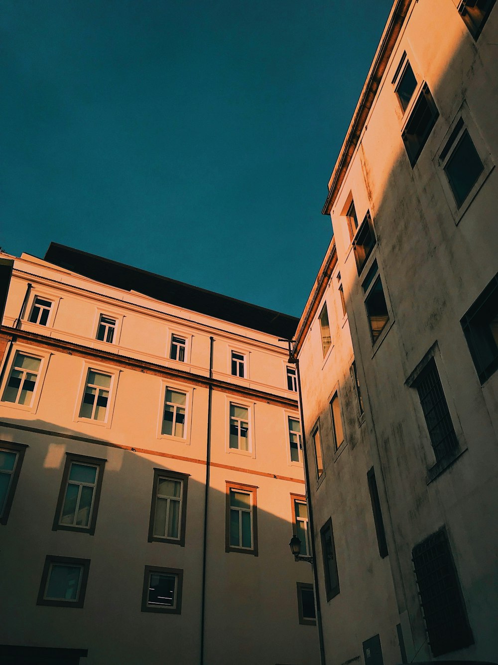 a view of a building from the ground looking up at the sky