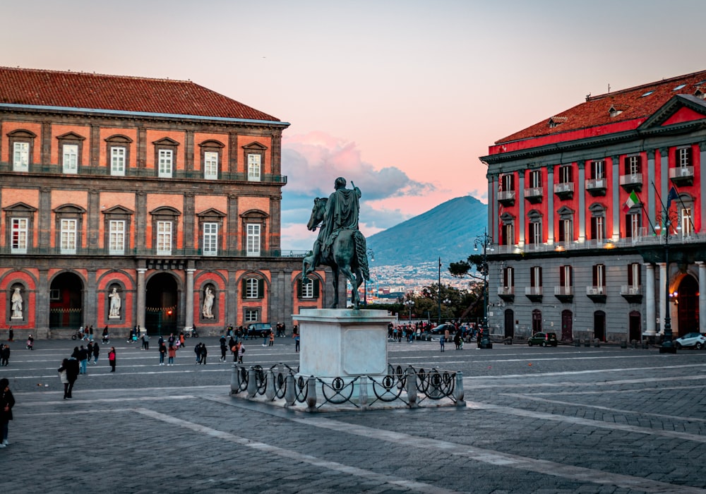 a statue of a man on a horse in a plaza