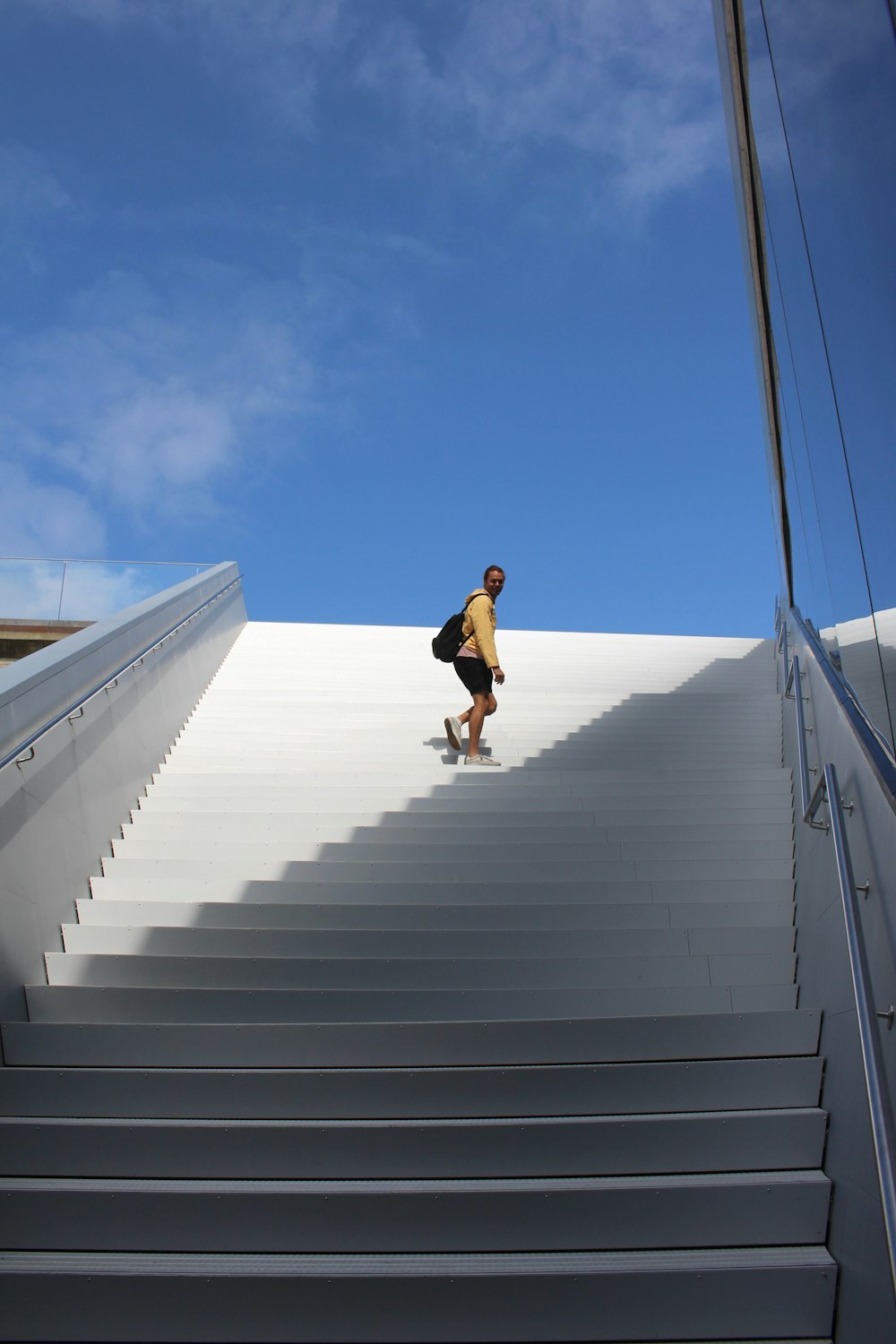 a man walking down a flight of stairs