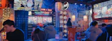 Interior shot of Japones restaurant glowing with neon lights, showcasing modern Tokyo-inspired decor.