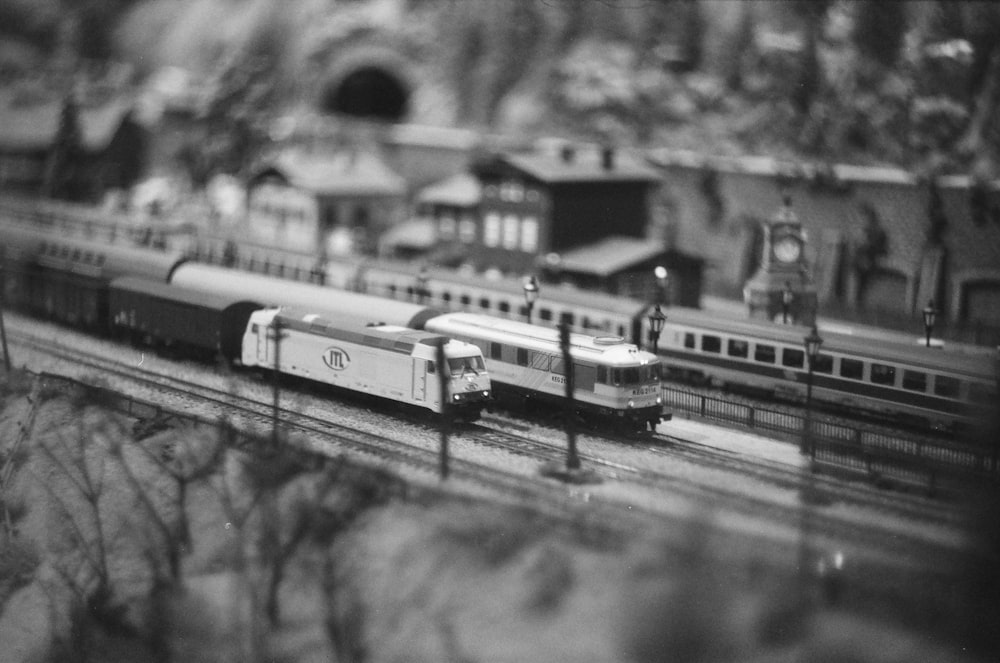 a black and white photo of a model train set