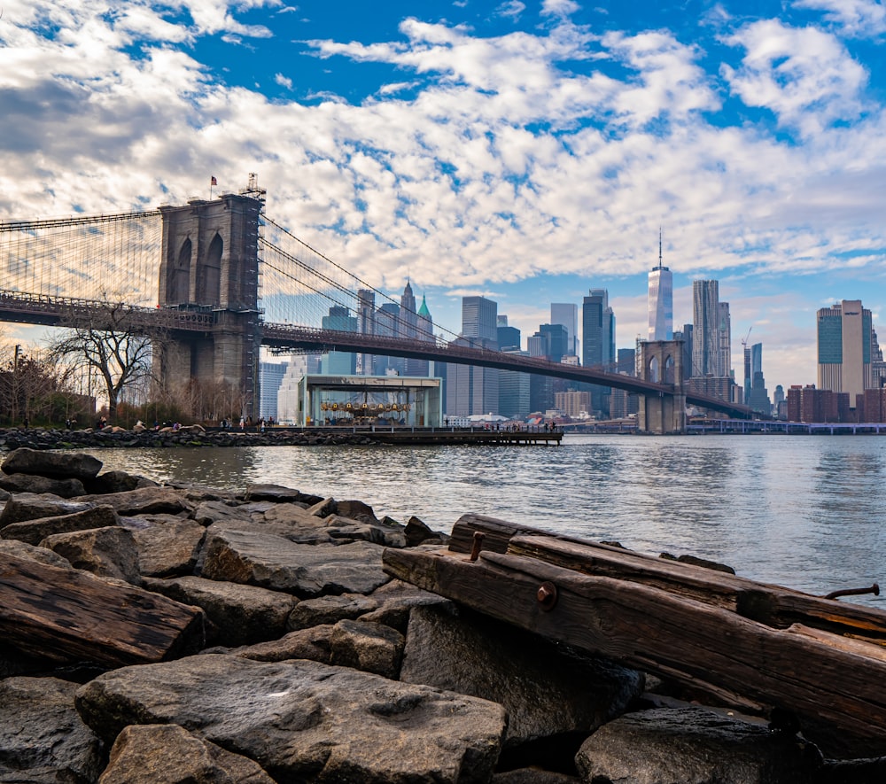 a view of the brooklyn bridge from across the water