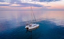 a sailboat floating in the middle of a large body of water