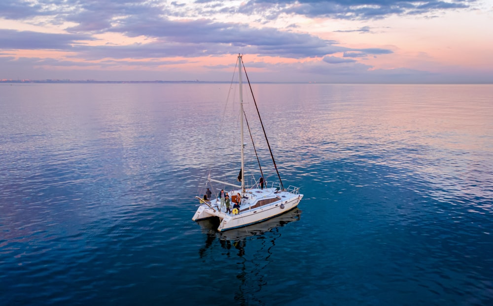 a sailboat floating in the middle of a large body of water