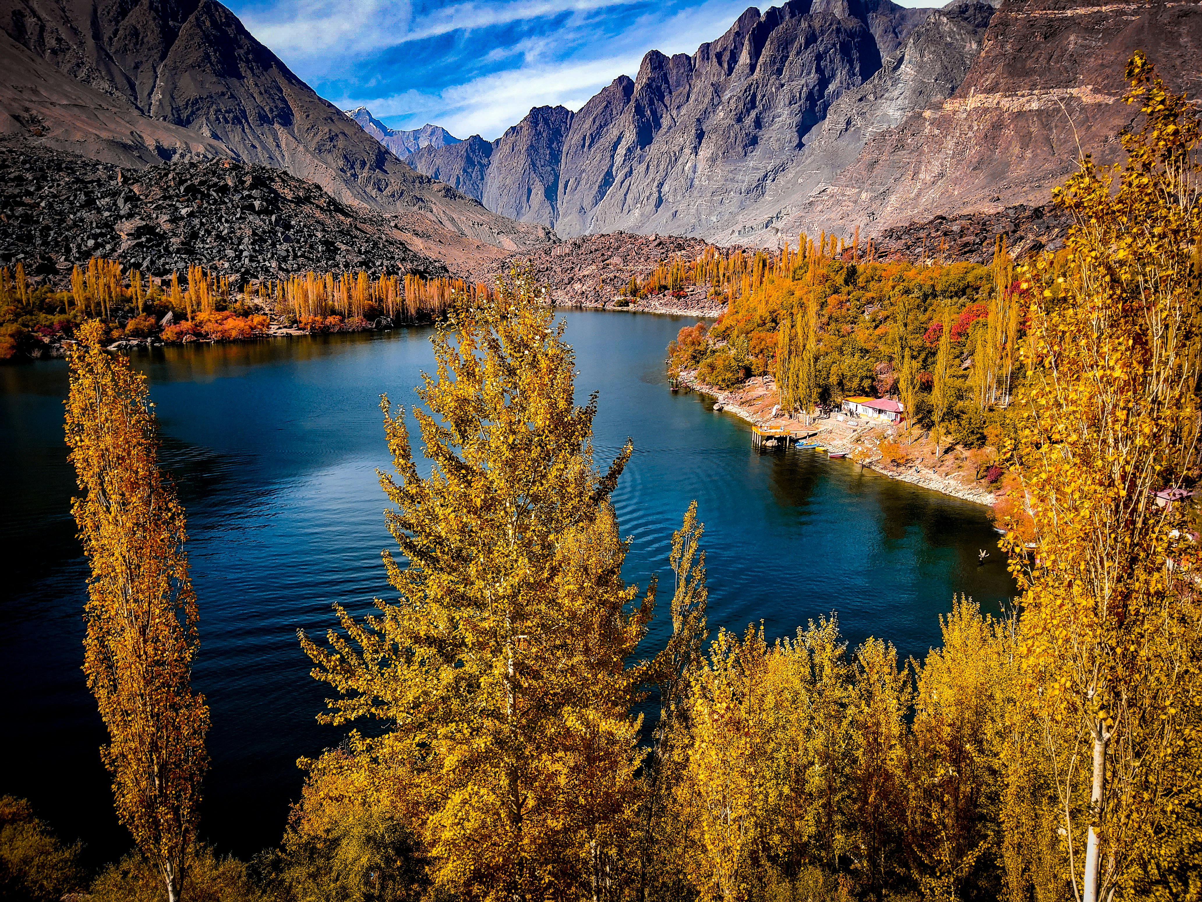 a body of water surrounded by mountains and trees