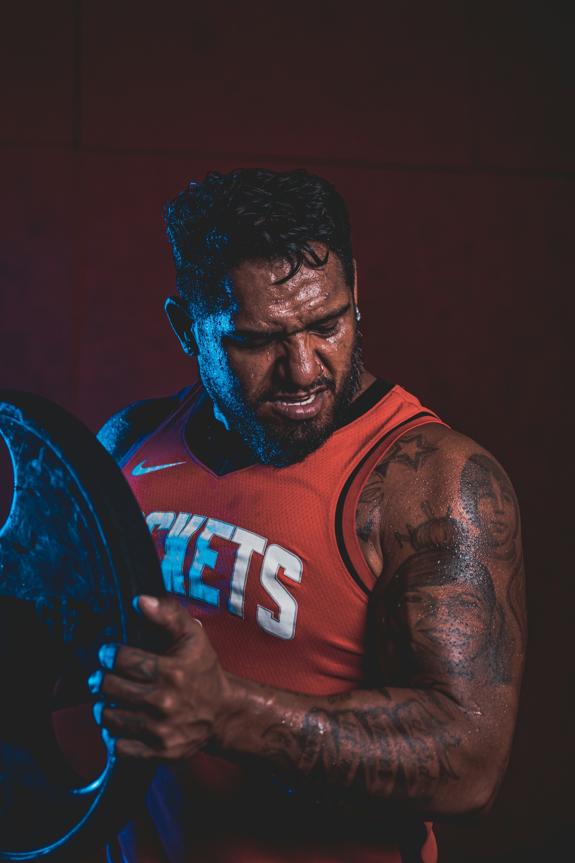 a man holding a barbell in his hands