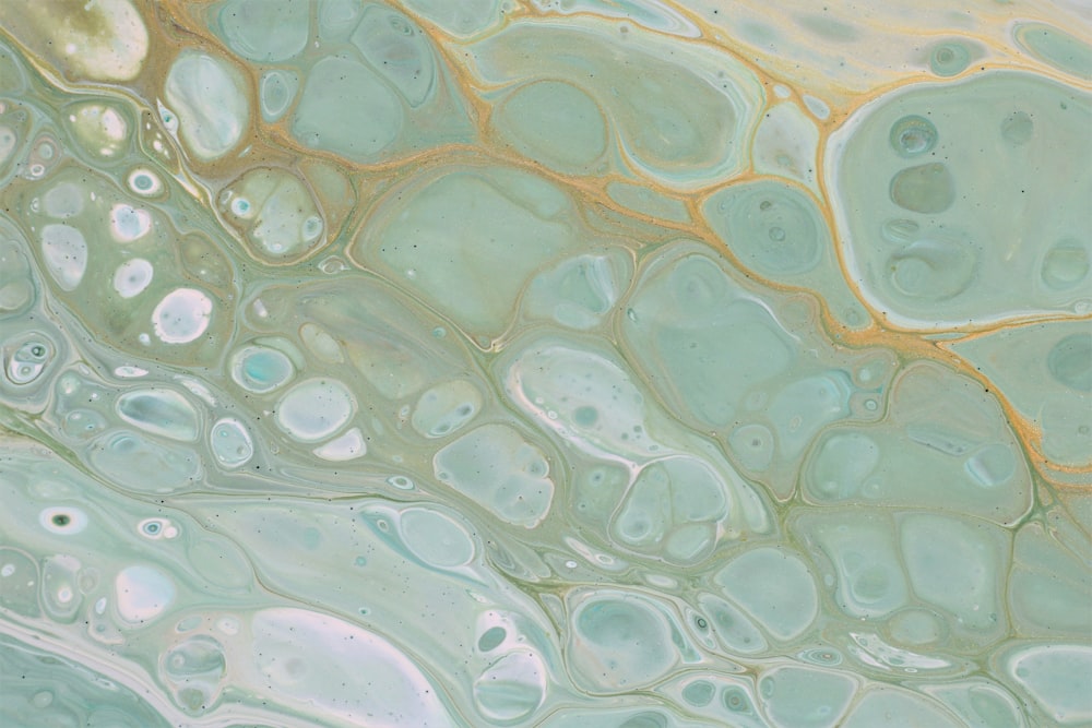 a close up of a green and yellow liquid