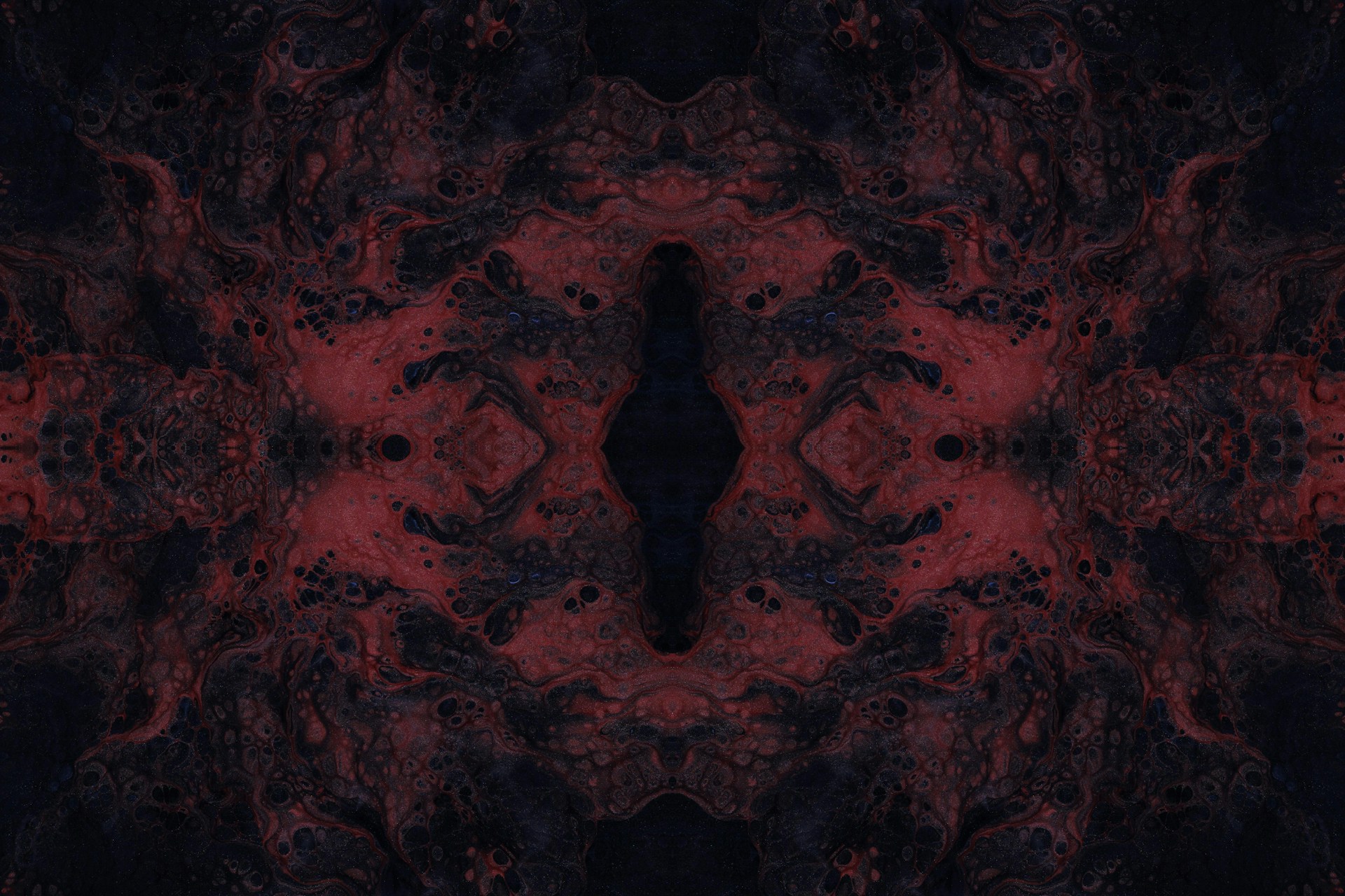 a red and black abstract background with a black and red design