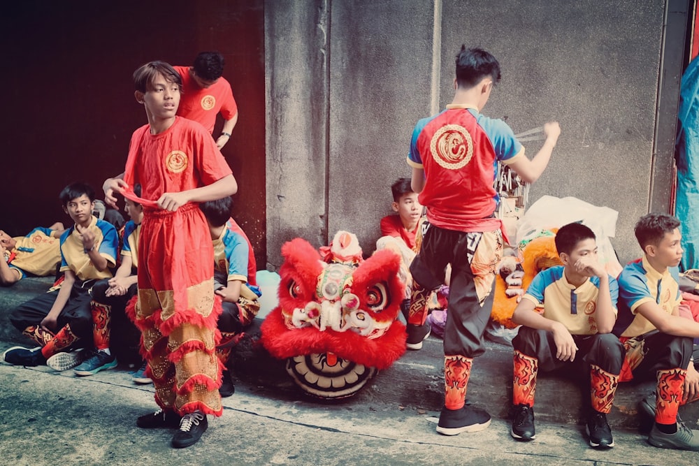 a group of young boys standing next to each other