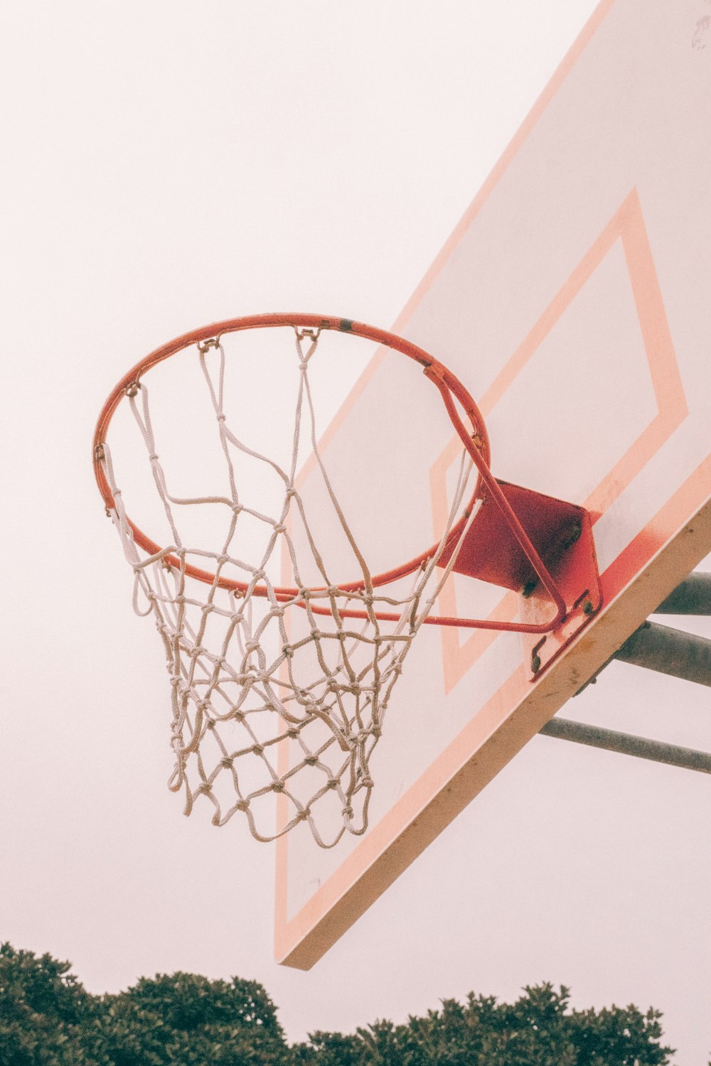 a basketball hoop with a basketball going through it