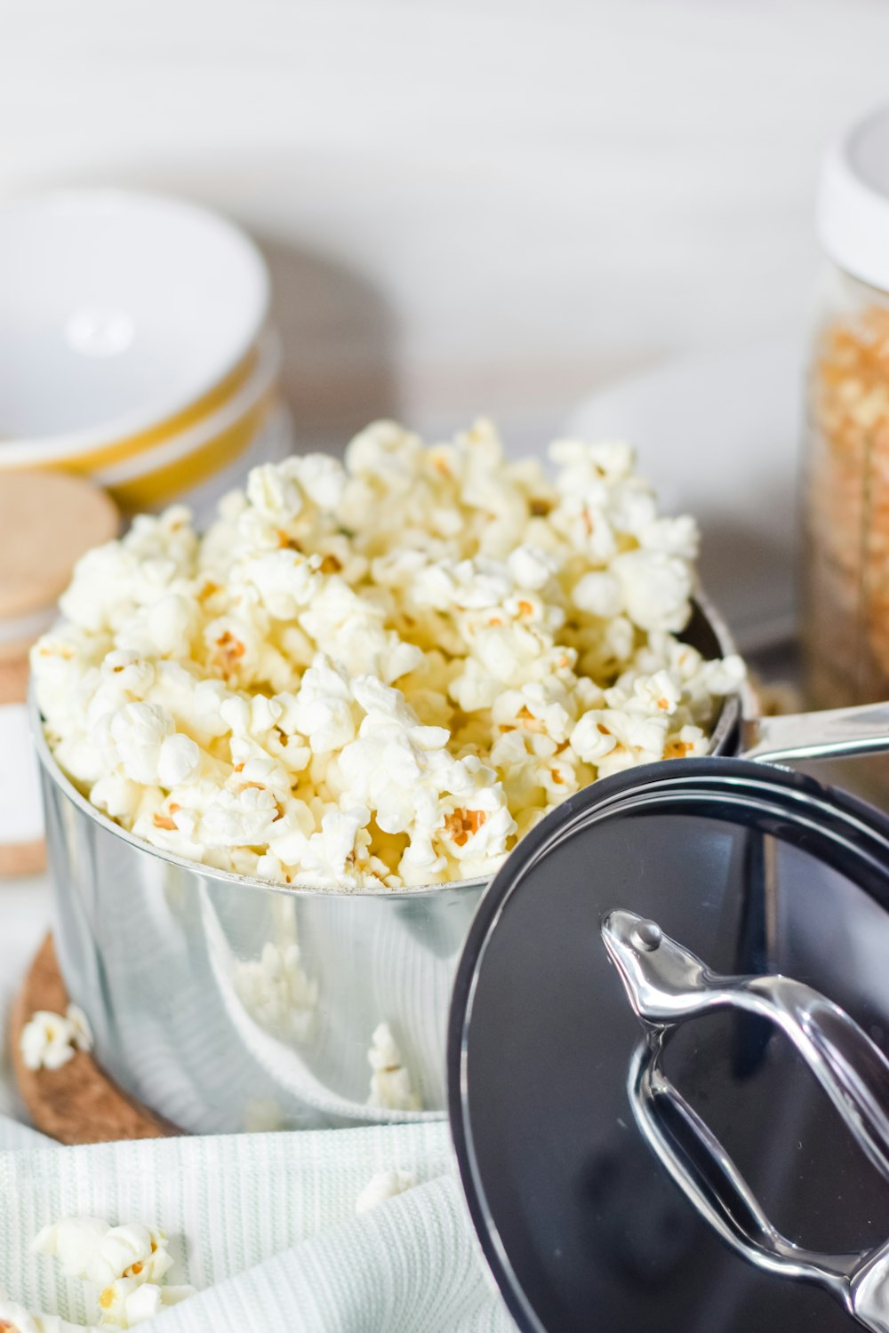 a close up of a bowl of popcorn on a table