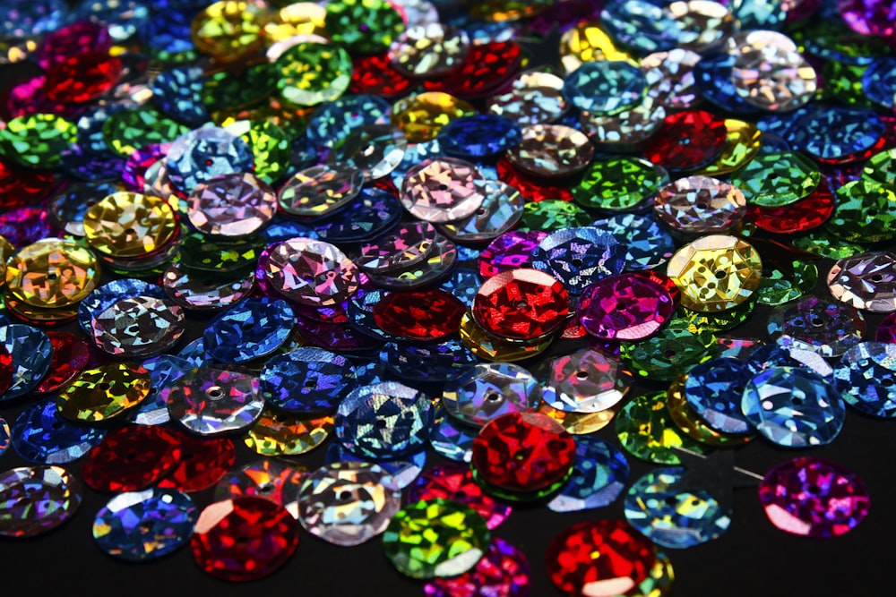 a bunch of different colored stones on a table
