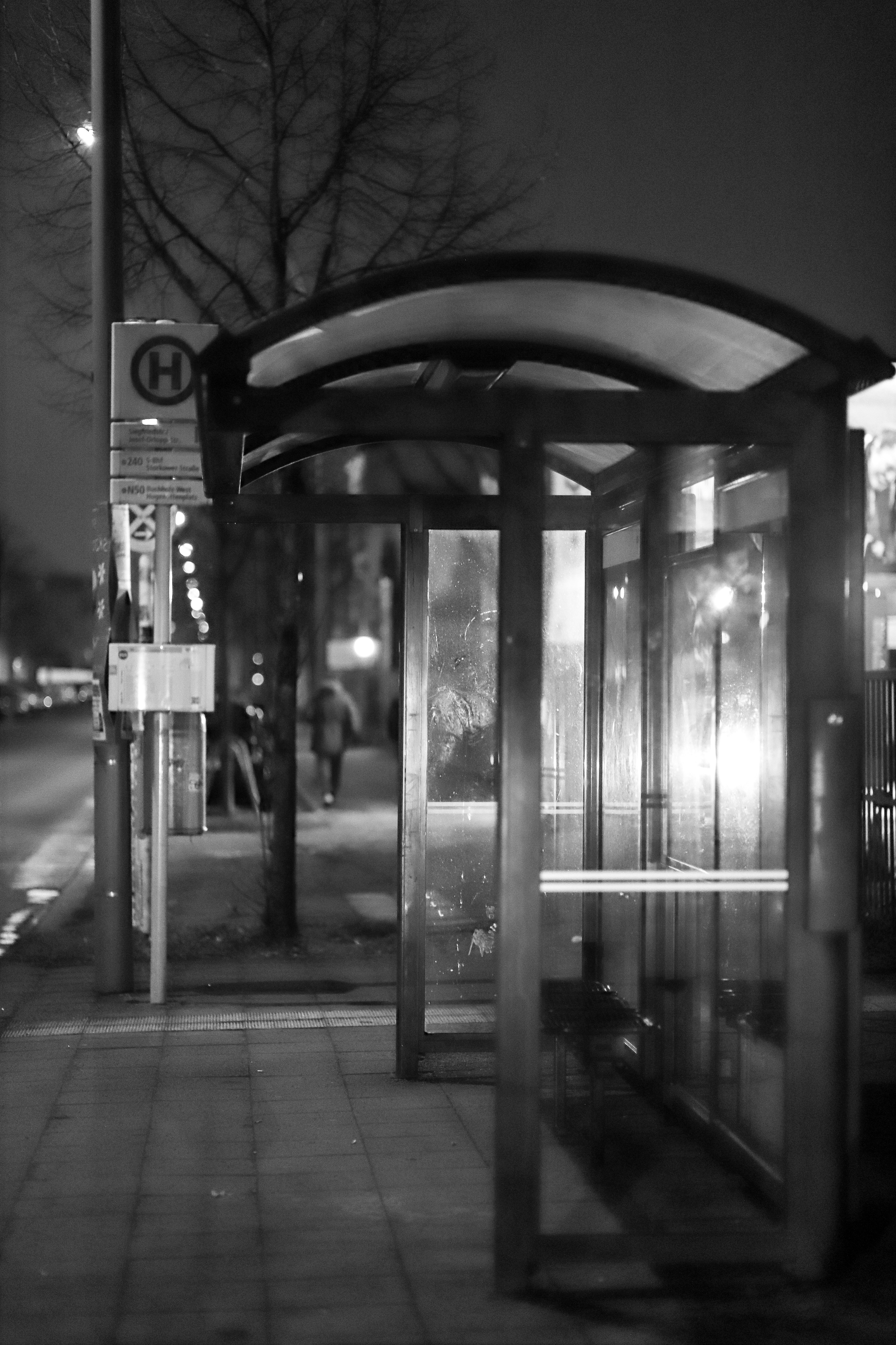 A black and white photo of a bus stop photo – Free Bus stop Image on ...