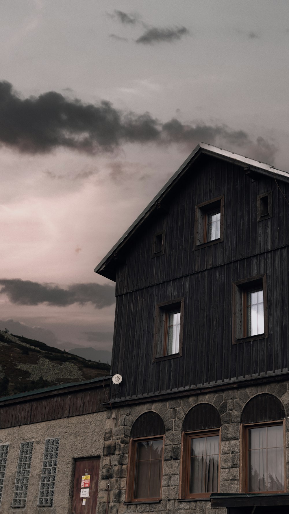 a building with windows and a clock on the side of it