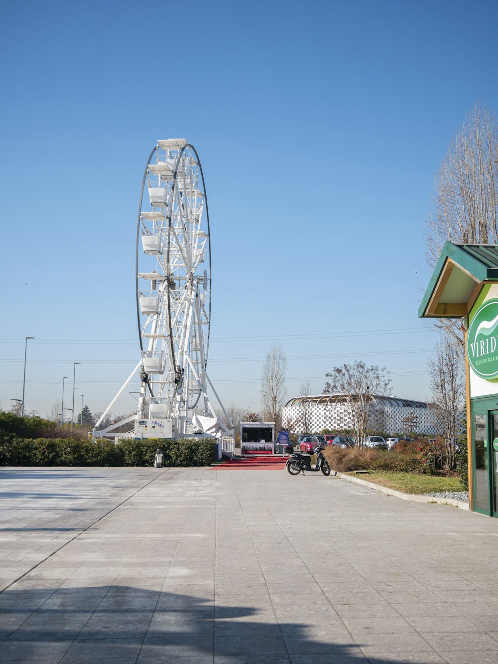 a large ferris wheel sitting next to a building