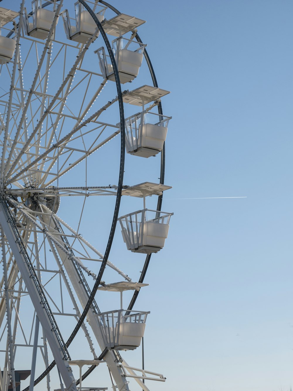 a ferris wheel with a clear blue sky in the background