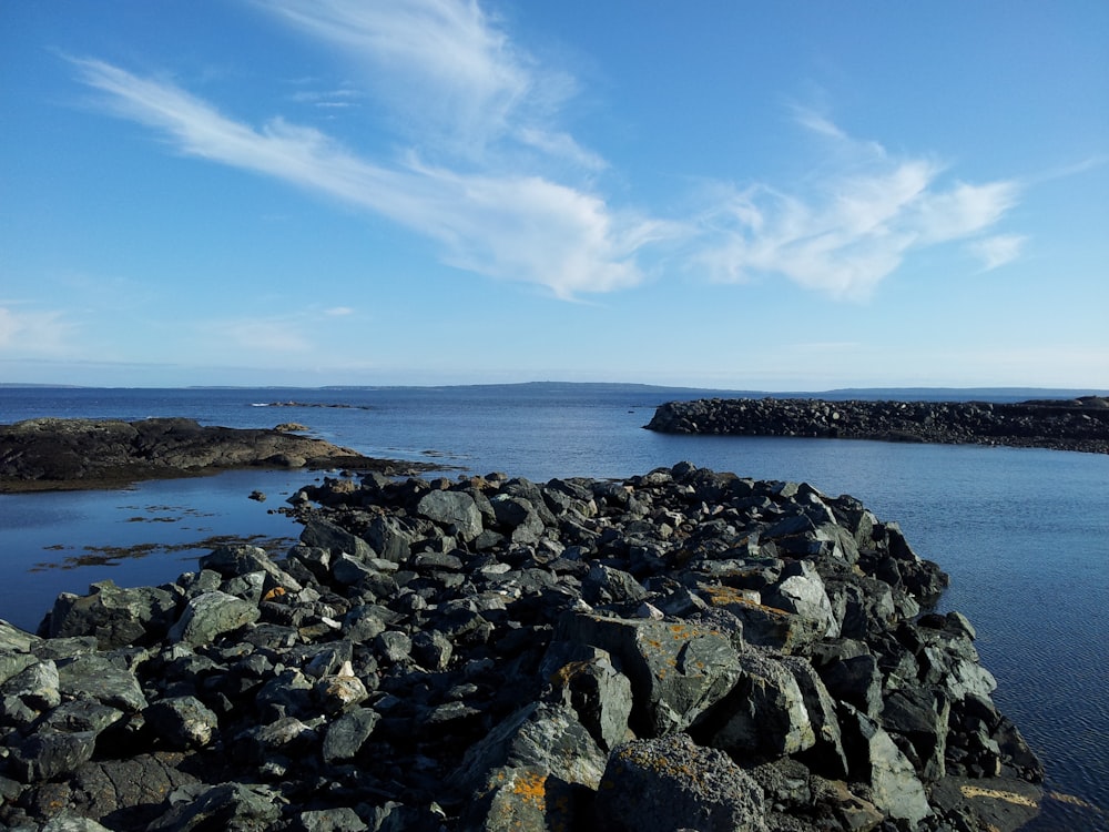 a large body of water surrounded by rocks