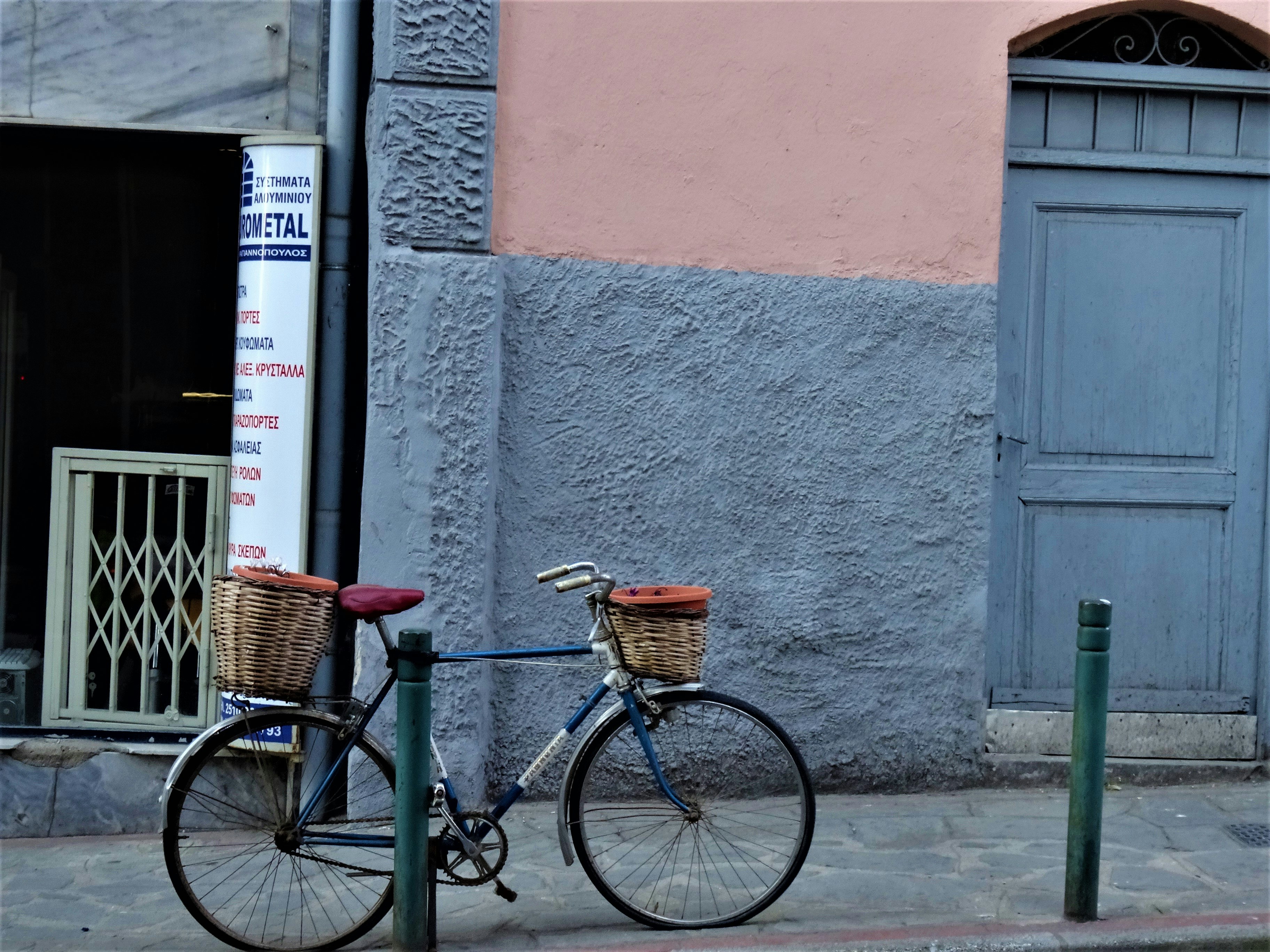 a bicycle parked on the side of a street