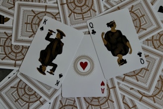four of a kind of playing cards sitting on top of each other