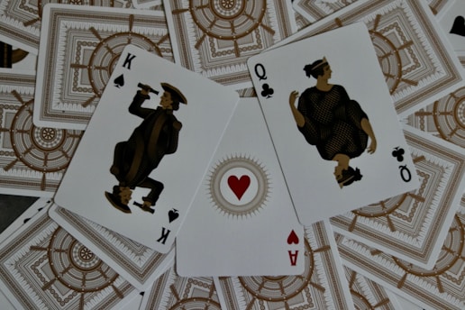 four of a kind of playing cards sitting on top of each other