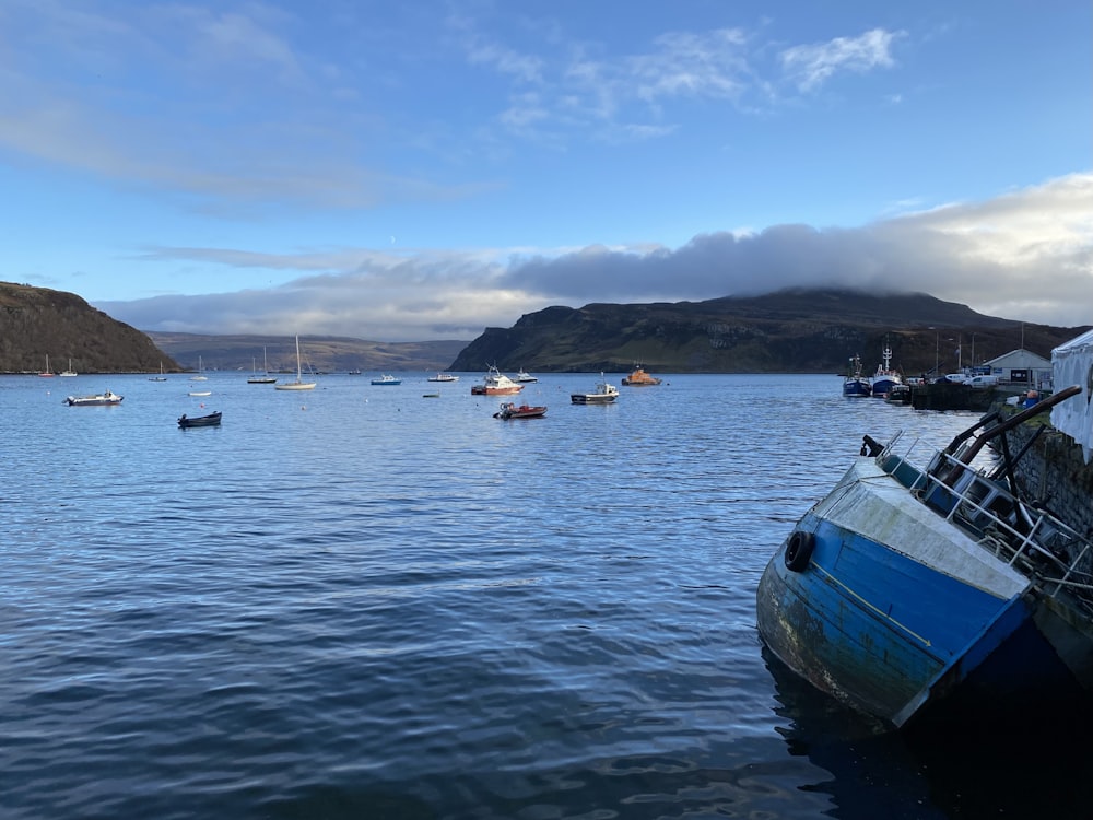 a group of boats floating on top of a large body of water