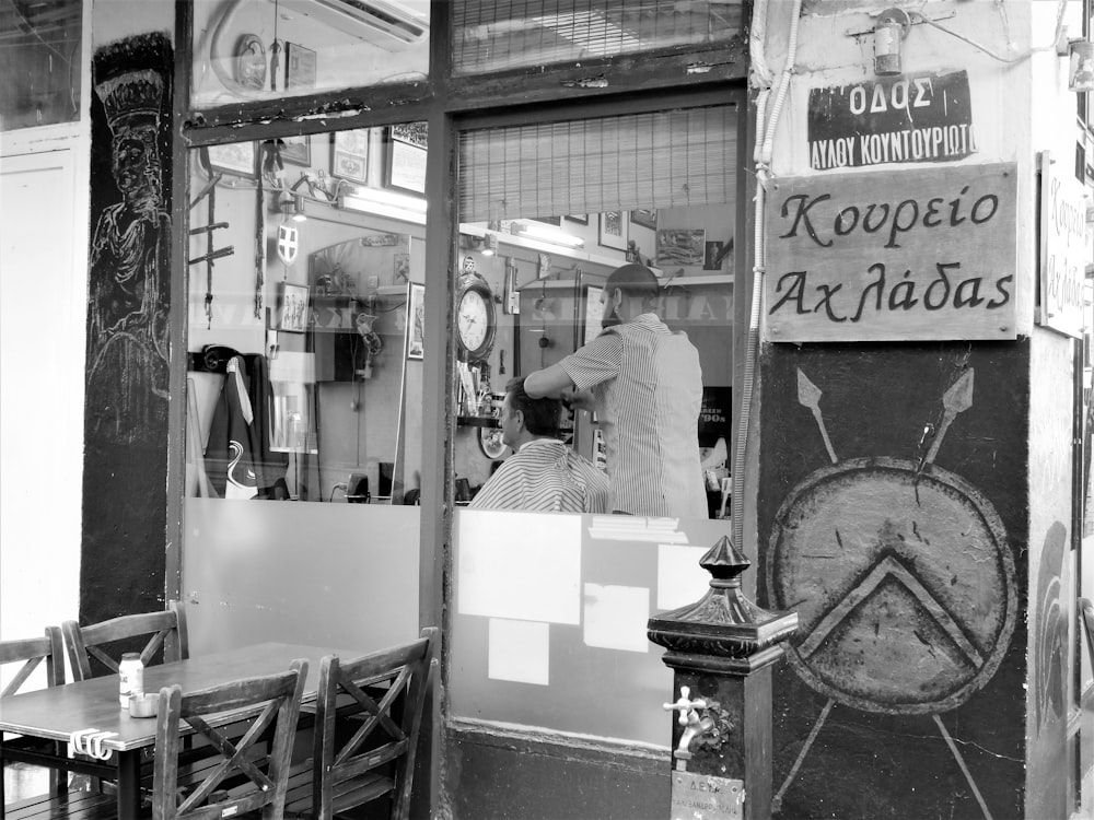 a black and white photo of a restaurant