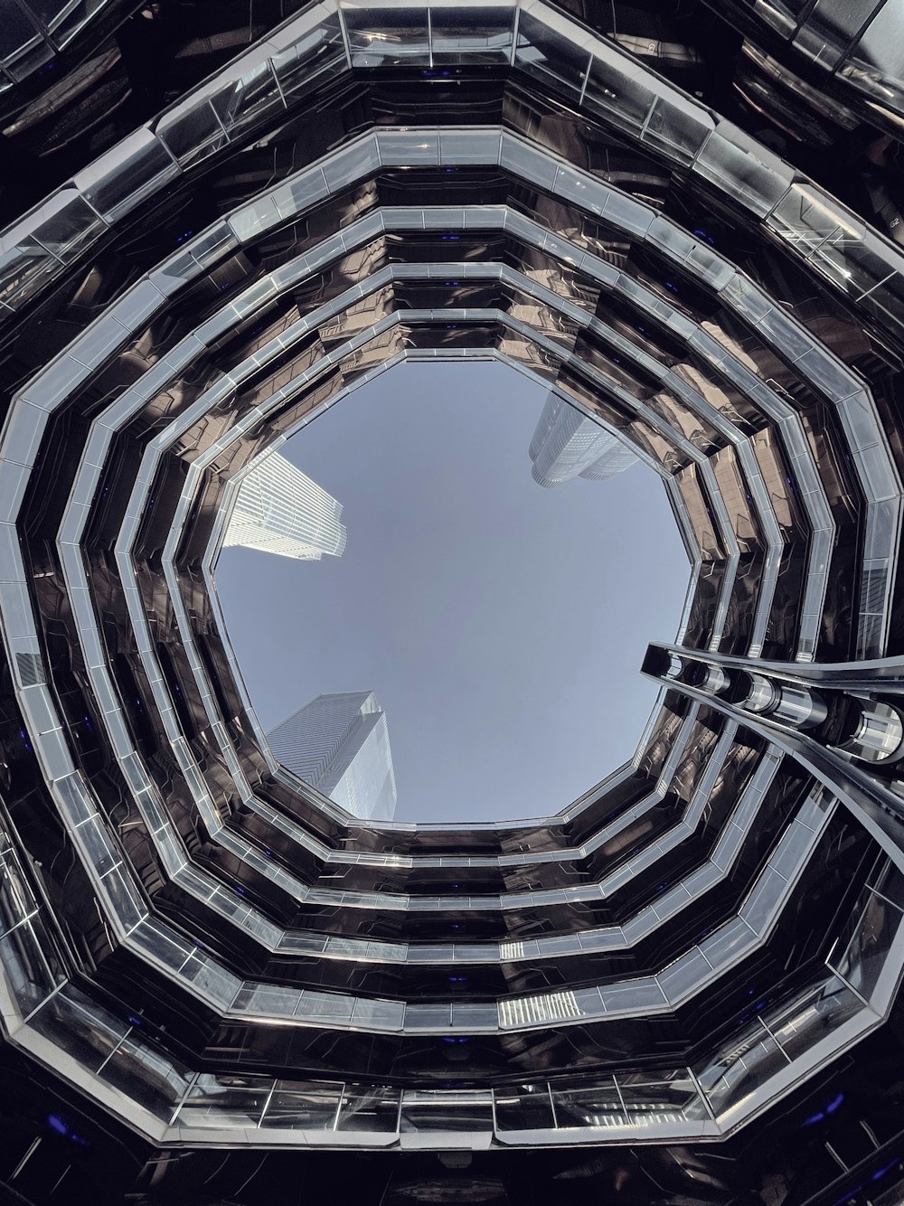 a very tall building with a sky view looking up