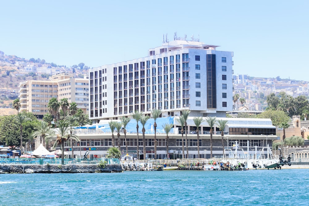 a large building sitting on the side of a body of water