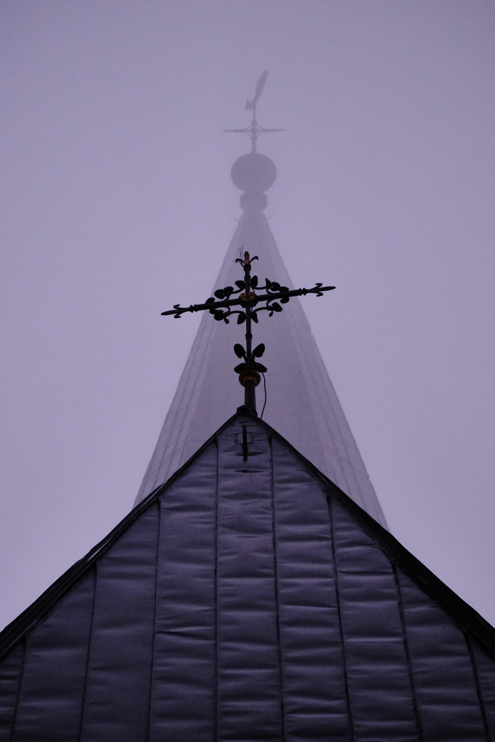 the top of a building with a cross on it