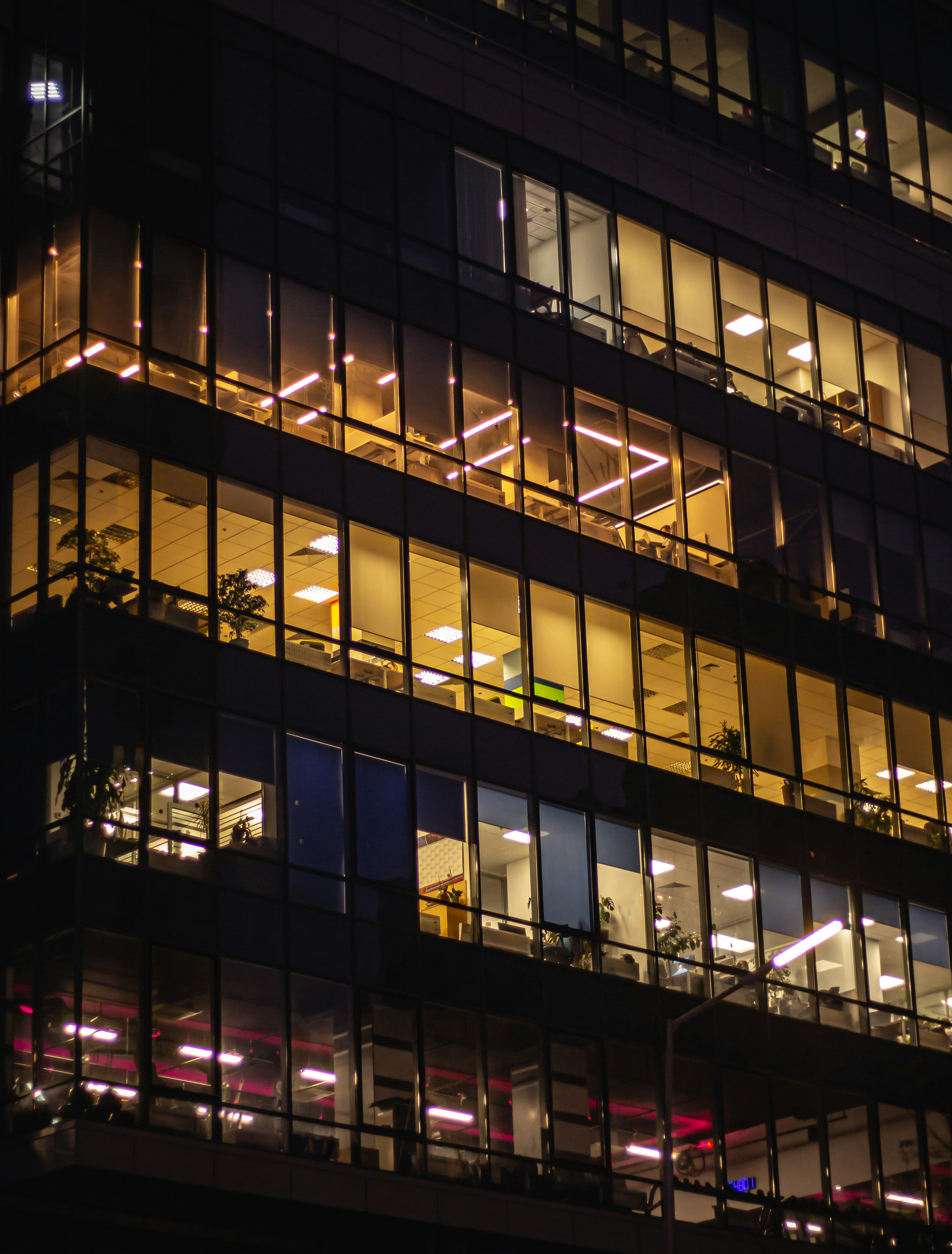 a very tall building with lots of windows at night