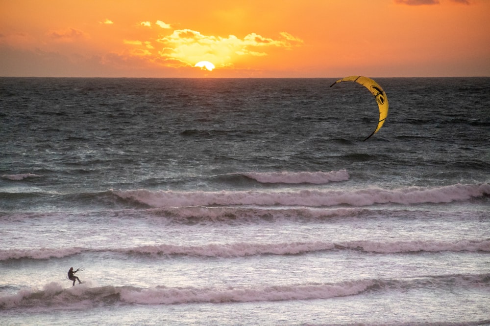 a person riding a surfboard on a wave in the ocean