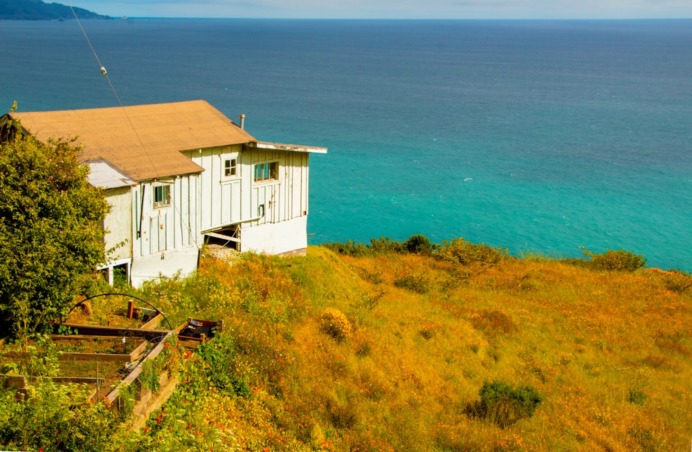 a house on a hill overlooking the ocean